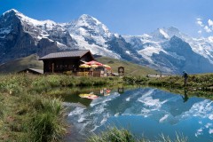 Eiger, Mönch, and Jungfrau (Ogre, Monk, and Virgin) reflect in a pond at Kleine Scheidegg in the Berner Oberland, Switzerland, Europe. Panorama stitched from six images. Published in September/October 2007 Sierra Magazine, Sierra Club Outings Eiger, Mönch, and Jungfrau